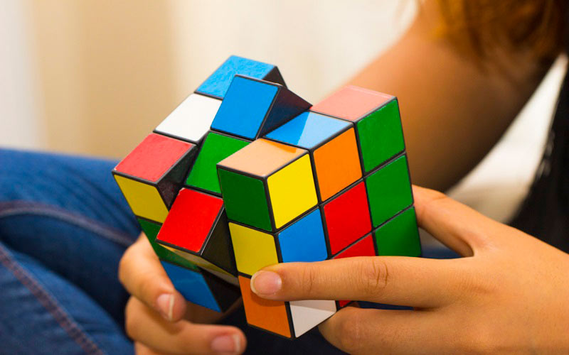 Practicing your IQ by doing rubik's cube puzzles.